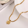 18k Gold Clovie Pendant along with a stainless steel Snake chain