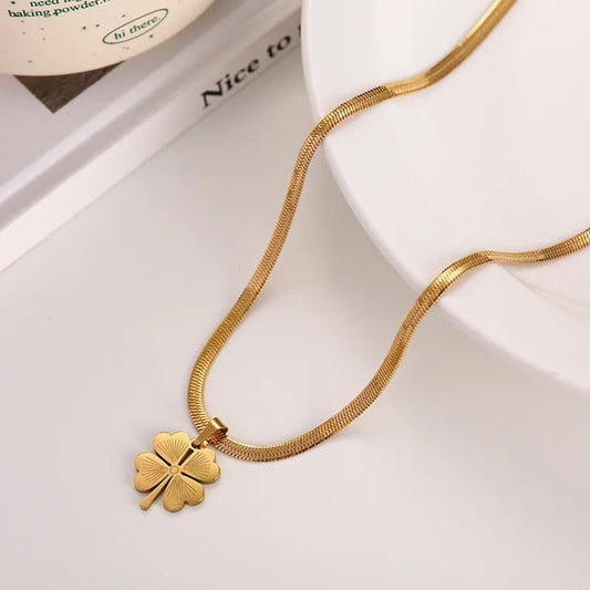 18k Gold Clovie Pendant along with a stainless steel Snake chain